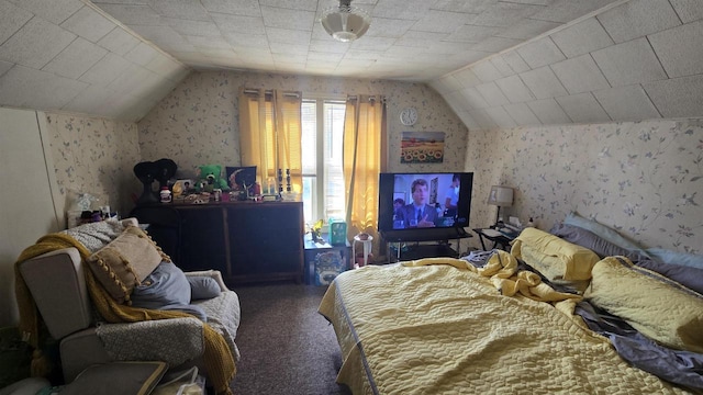 carpeted bedroom featuring wallpapered walls and lofted ceiling