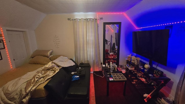 bedroom featuring vaulted ceiling