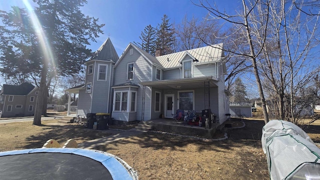 victorian house with metal roof and a standing seam roof