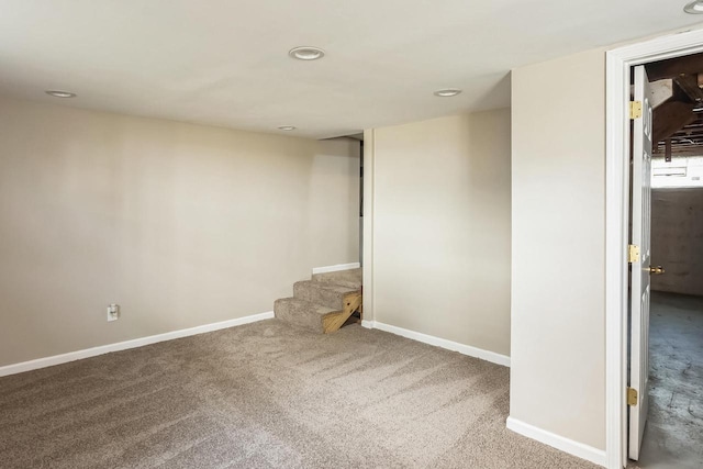 empty room featuring stairway, recessed lighting, carpet, and baseboards