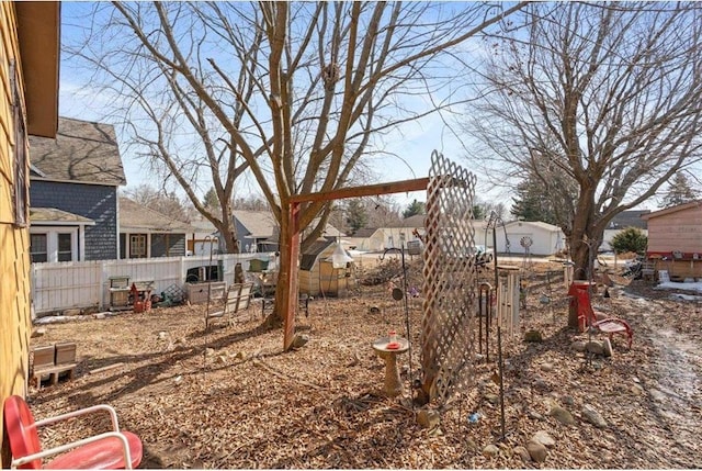 view of yard with fence and a residential view