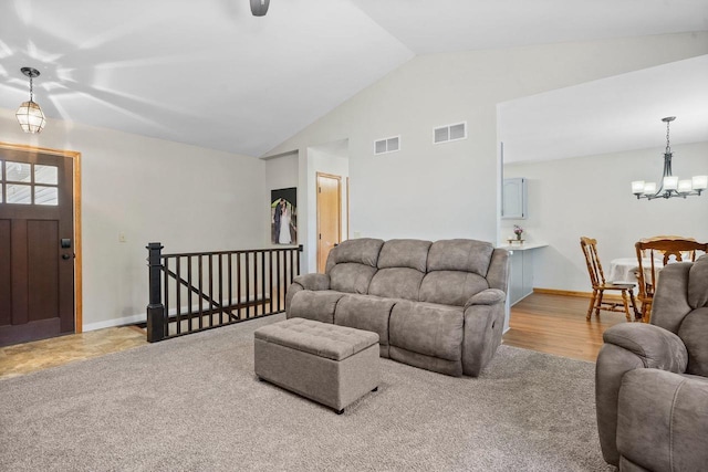 living room featuring visible vents, baseboards, and an inviting chandelier