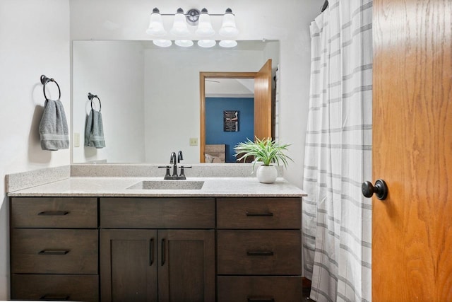 bathroom with ensuite bath and vanity