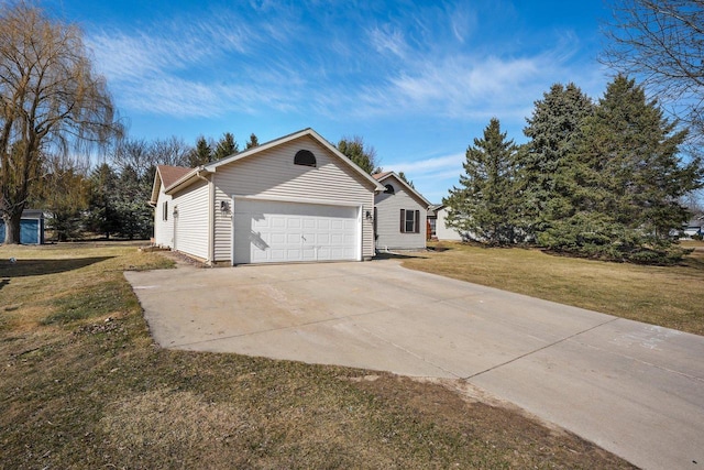 view of property exterior featuring an attached garage, a yard, and driveway