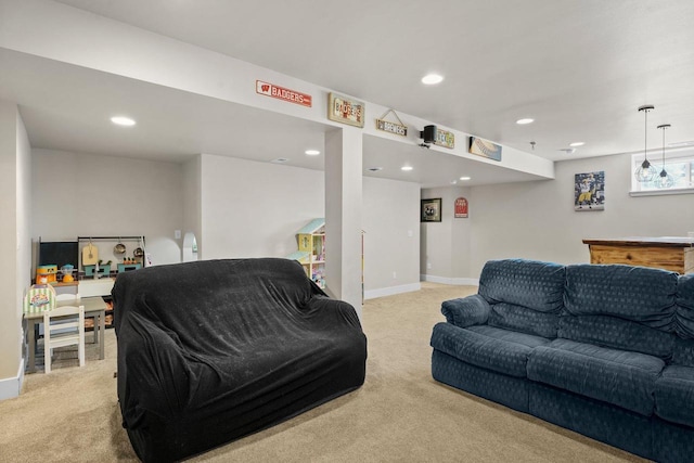 living area with recessed lighting, baseboards, and light carpet