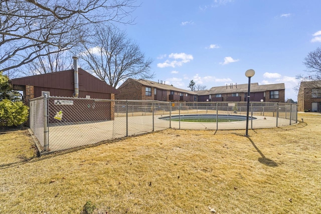 view of property's community featuring fence