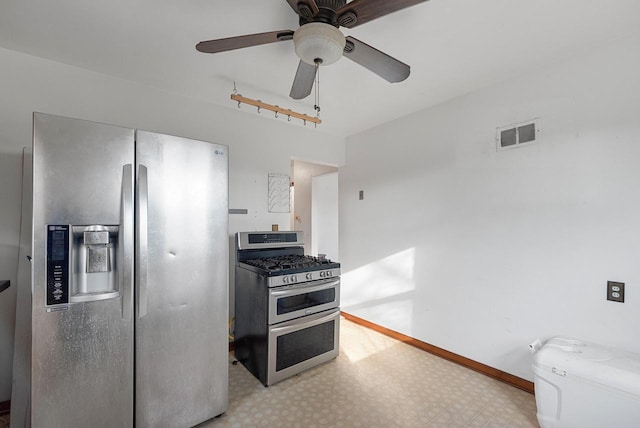 kitchen with light floors, baseboards, visible vents, ceiling fan, and stainless steel appliances