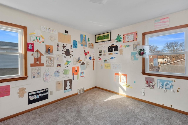 game room featuring visible vents, baseboards, and carpet floors