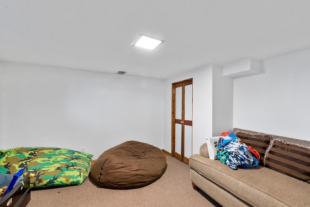 recreation room with visible vents and carpet