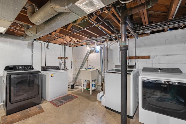 unfinished below grade area featuring a sink and washer and clothes dryer