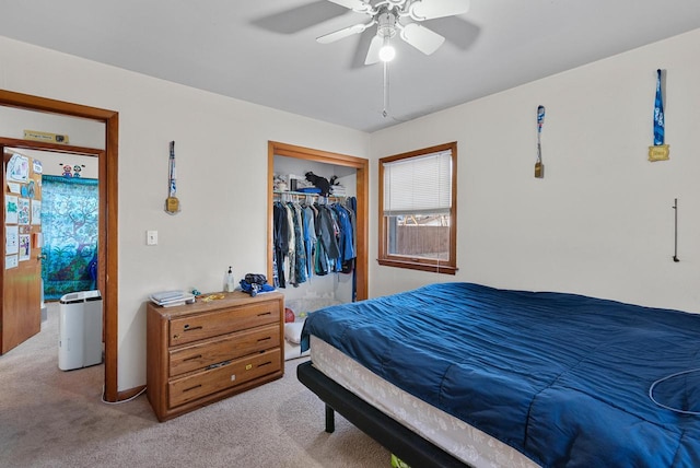 bedroom with a closet, carpet, and ceiling fan