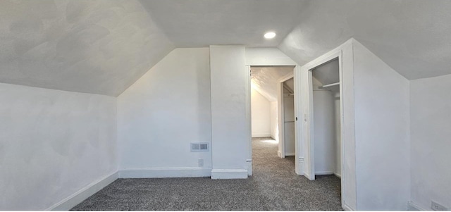 bonus room with baseboards, visible vents, carpet floors, and lofted ceiling