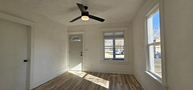 interior space with visible vents and a ceiling fan