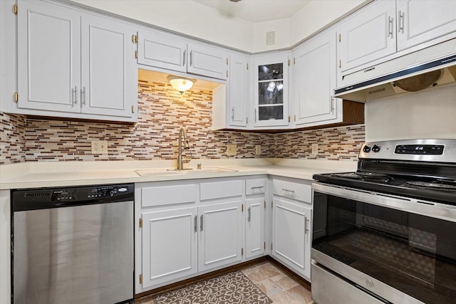 kitchen with a sink, light countertops, under cabinet range hood, and stainless steel appliances