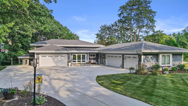 view of front of house with concrete driveway, an attached garage, and stone siding