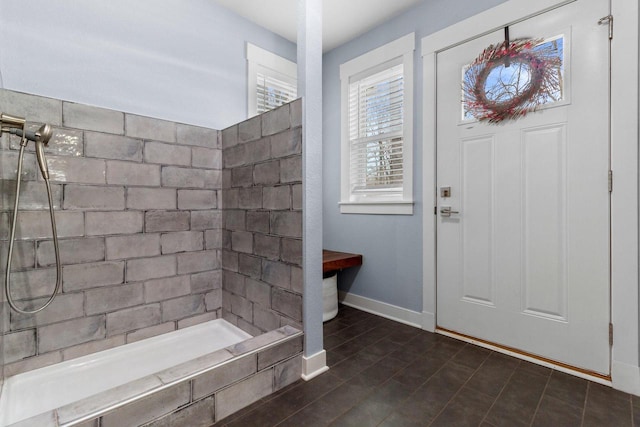 foyer featuring baseboards