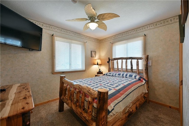 carpeted bedroom with baseboards, multiple windows, and a ceiling fan