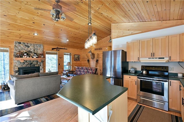 kitchen featuring light brown cabinetry, under cabinet range hood, and stainless steel appliances