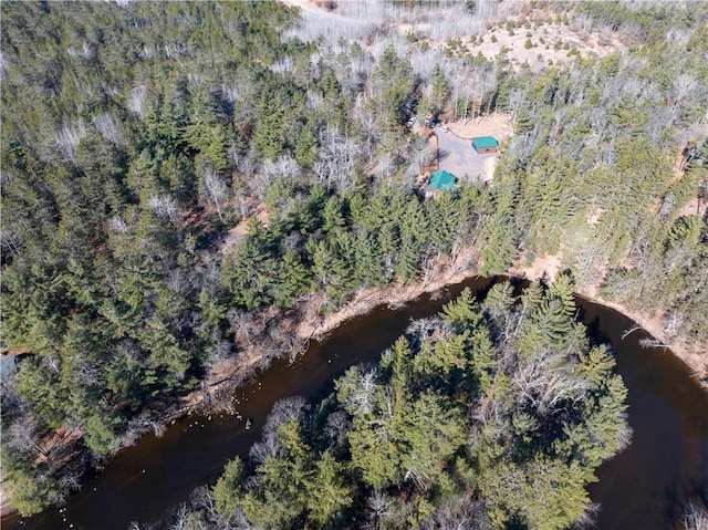 drone / aerial view featuring a forest view