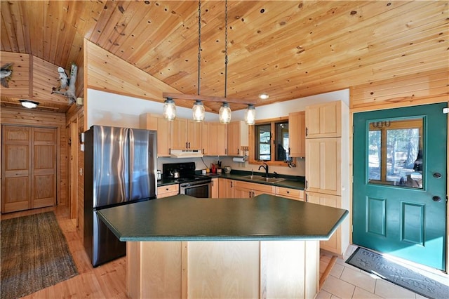 kitchen with light brown cabinets, a sink, dark countertops, appliances with stainless steel finishes, and exhaust hood