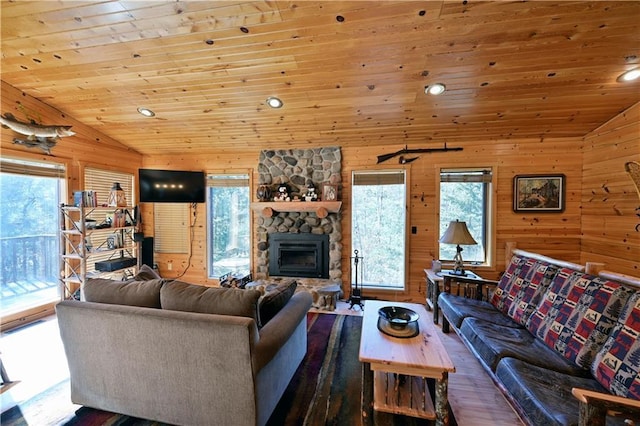 living area with a fireplace, lofted ceiling, wood ceiling, and wood finished floors