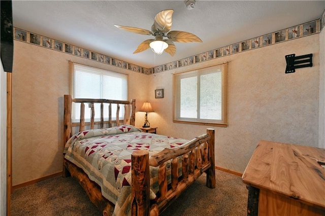 bedroom with multiple windows, baseboards, ceiling fan, and carpet floors