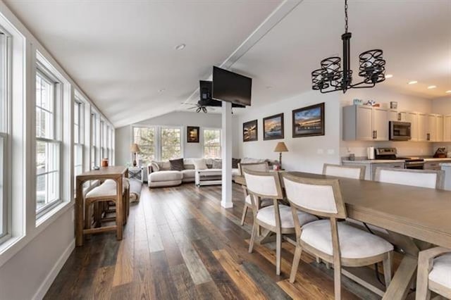 dining room with baseboards, recessed lighting, dark wood-style flooring, vaulted ceiling, and ceiling fan with notable chandelier