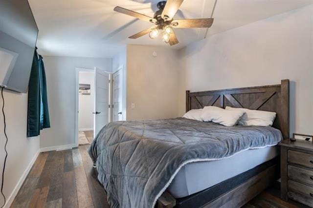 bedroom featuring baseboards, a ceiling fan, and hardwood / wood-style flooring