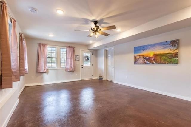 interior space featuring ceiling fan, recessed lighting, baseboards, and finished concrete floors