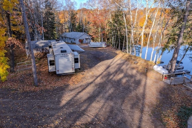 drone / aerial view featuring a forest view