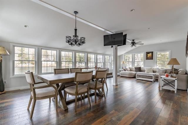 dining room featuring baseboards, lofted ceiling, dark wood finished floors, and ceiling fan with notable chandelier