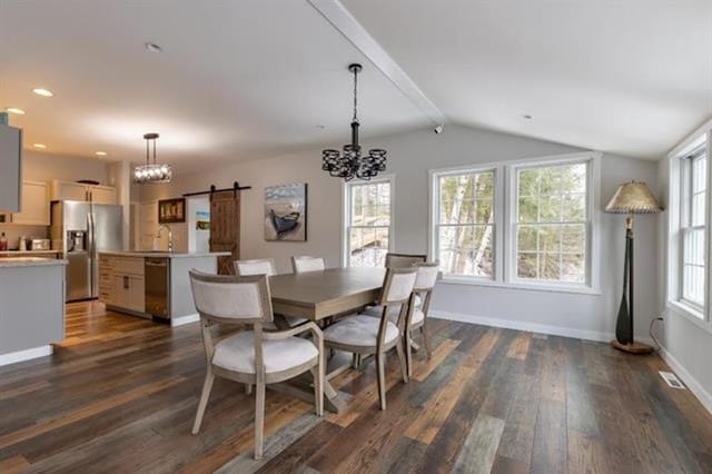 dining space featuring dark wood-type flooring, lofted ceiling with beams, a barn door, baseboards, and a chandelier