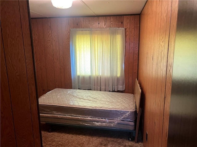 bedroom with wooden walls