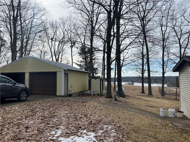 view of home's exterior with an outbuilding and a garage