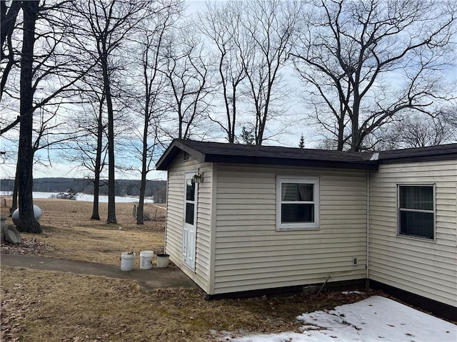 view of outbuilding with a water view