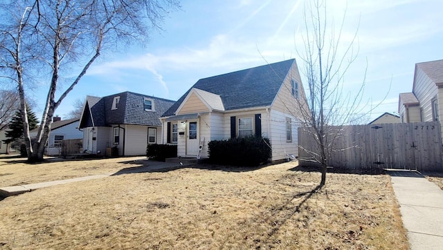 view of front of home featuring fence