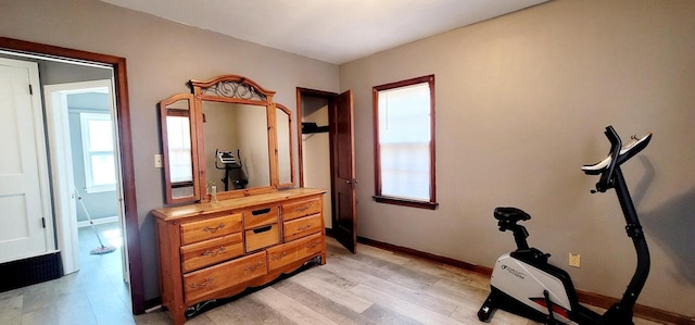 interior space with light wood-type flooring and baseboards