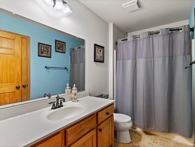 full bath with visible vents, toilet, a shower with curtain, tile patterned floors, and vanity