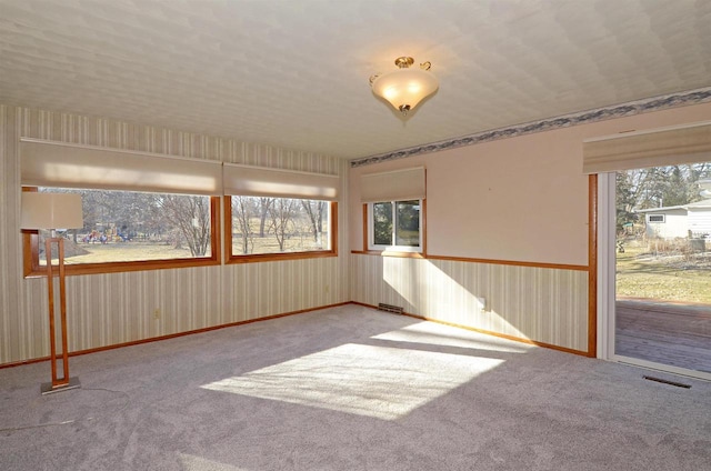 5511 Maywood Rd, Monona, WI 53716 - spare room with visible vents and carpet floors
