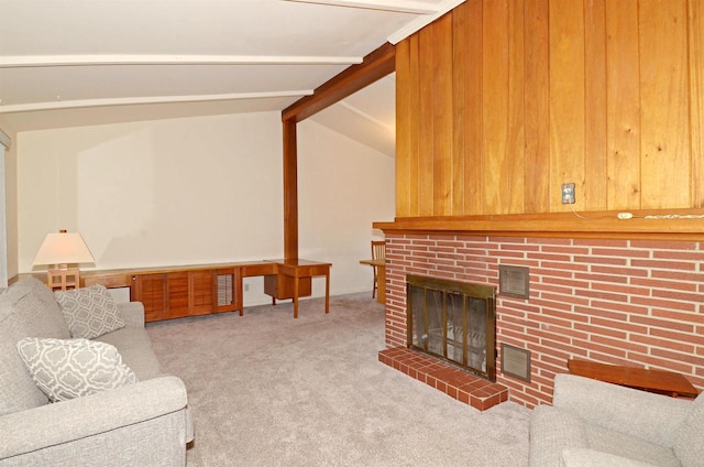 5511 Maywood Rd, Monona, WI 53716 - living area featuring a fireplace, vaulted ceiling with beams, carpet, and visible vents