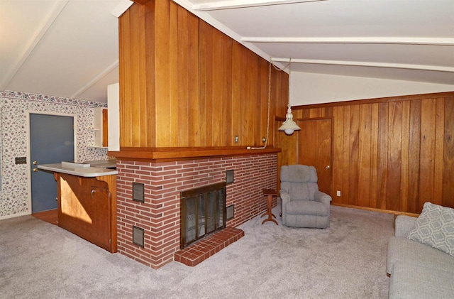 5511 Maywood Rd, Monona, WI 53716 - living area with carpet floors, a brick fireplace, wood walls, and vaulted ceiling