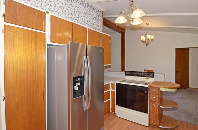 5511 Maywood Rd, Monona, WI 53716 - kitchen with white electric stove, stainless steel fridge, an inviting chandelier, a peninsula, and light countertops