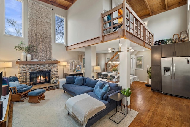 3103 W Riverland Dr, Mequon, WI 53092 - living area with high vaulted ceiling, wood finished floors, wooden ceiling, and beam ceiling