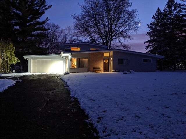 3103 W Riverland Dr, Mequon, WI 53092 - view of front of home with driveway and a garage