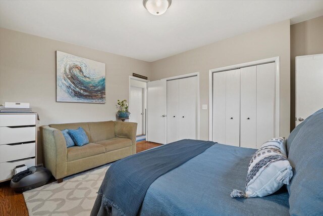 3103 W Riverland Dr, Mequon, WI 53092 - bedroom with wood finished floors and two closets