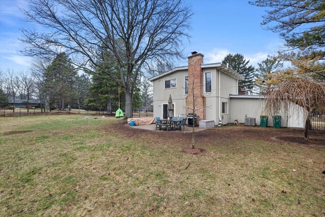 3103 W Riverland Dr, Mequon, WI 53092 - exterior space featuring fence, central AC, and a patio