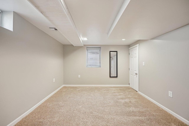 below grade area with recessed lighting, visible vents, carpet flooring, and baseboards