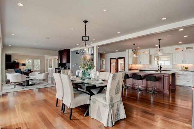 dining area with recessed lighting and wood finished floors