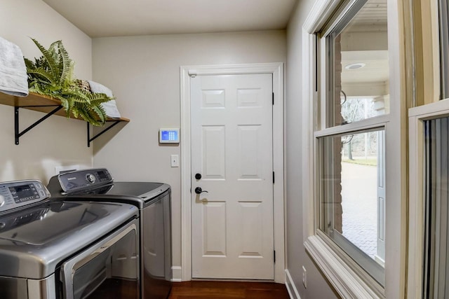 laundry room featuring washer and clothes dryer, laundry area, baseboards, and dark wood-style flooring