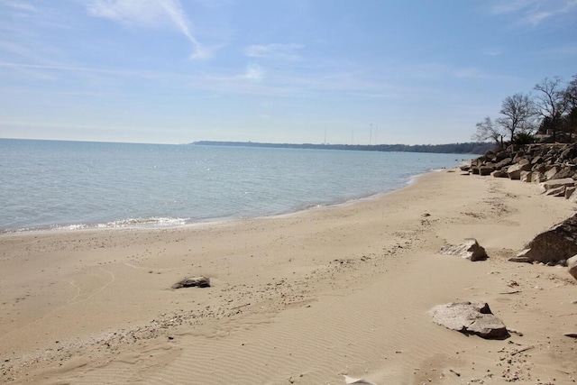 property view of water featuring a beach view